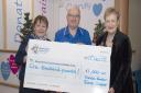 Irene Casper (left) and Dreda Gordon (right) hand a cheque over to Mount Vernon Cancer Care Charitable Fund at Lister Hospital.