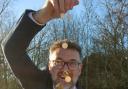 Charles Hanson with some of the gold coins found in a linen cupboard