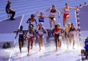 St Albans' Lizzie Bird leaps over the water jump in the 3,000m steeplechase semi-final. Picture: MARTIN RICKETT/PA