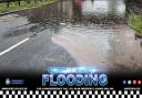 Police have closed a road due to flooding