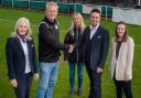 Staff from Taylor Wimpey South Midlands with Richard Smith, chairman at the football club, and Nikki Dutton, one of the club's volunteers