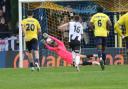 Michael Johnson saves the injury-time penalty for St Albans City against Bath. Picture: JIM STANDEN