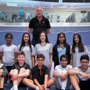 The successful Herts U15 badminton side - back row: Chenara De Silva, Aditi Dhelaria, Anna Stewart, Saghana Thayaparan, Aayushi Dhelaria. Front row: Hanson Shinghei Sy, Jaxon Clarke, Johan Jospeh, Jeff Ani Joseph, Dev Mathur with Mike Newlove at the