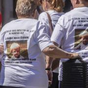 Victims and campaigners outside Central Hall in Westminster, London, after the publication of the Infected Blood Inquiry report (Jeff Moore/PA)