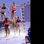 St Albans' Lizzie Bird leaps over the water jump in the 3,000m steeplechase semi-final. Picture: MARTIN RICKETT/PA