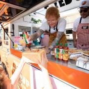 Ed Sheeran signed supermarket items with hot sauce.