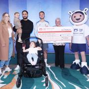 Spurs' James Maddison handed over the cheque to the chief exec of Noah’s Ark Children’s Hospice, Sophie Andrews OBE