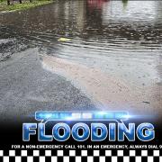 Police have closed a road due to flooding