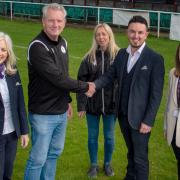 Staff from Taylor Wimpey South Midlands with Richard Smith, chairman at the football club, and Nikki Dutton, one of the club's volunteers