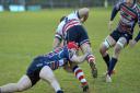 Max Wilkins puts in a tackle