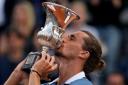 Alexander Zverev kisses the Italian Open trophy (Alessandra Tarantino/AP)