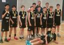 Oaklands Wolves U13 boys celebrate their tournament success. Picture: OAKLANDS BALL