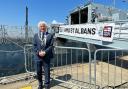 Mayor Rowlands standing alongside the revamped ship