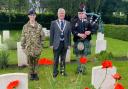 Piper George Carr performs at Hatfield Road Cemetery