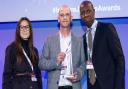 Tony is presented with his award by the Parole Board's Faith Leary and BBC anchor Clive Myrie