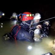 Chris Jewell with anaesthetist Dr Richard Harris and one of the boys during the cave rescue.