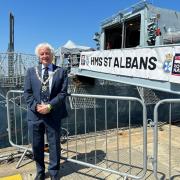 Mayor Rowlands standing alongside the revamped ship