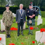 Piper George Carr performs at Hatfield Road Cemetery