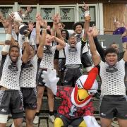 Shogun Katana celebrate their cup win at the Pub Sevens with new Harpenden mascot, Faz. Picture: HARPENDEN RFC