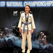 Zara Fitzgerald of Redbourn Taekwondo Club with her medals. Picture: BRUNEL UNIVERSITY