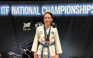 Zara Fitzgerald of Redbourn Taekwondo Club with her medals. Picture: BRUNEL UNIVERSITY